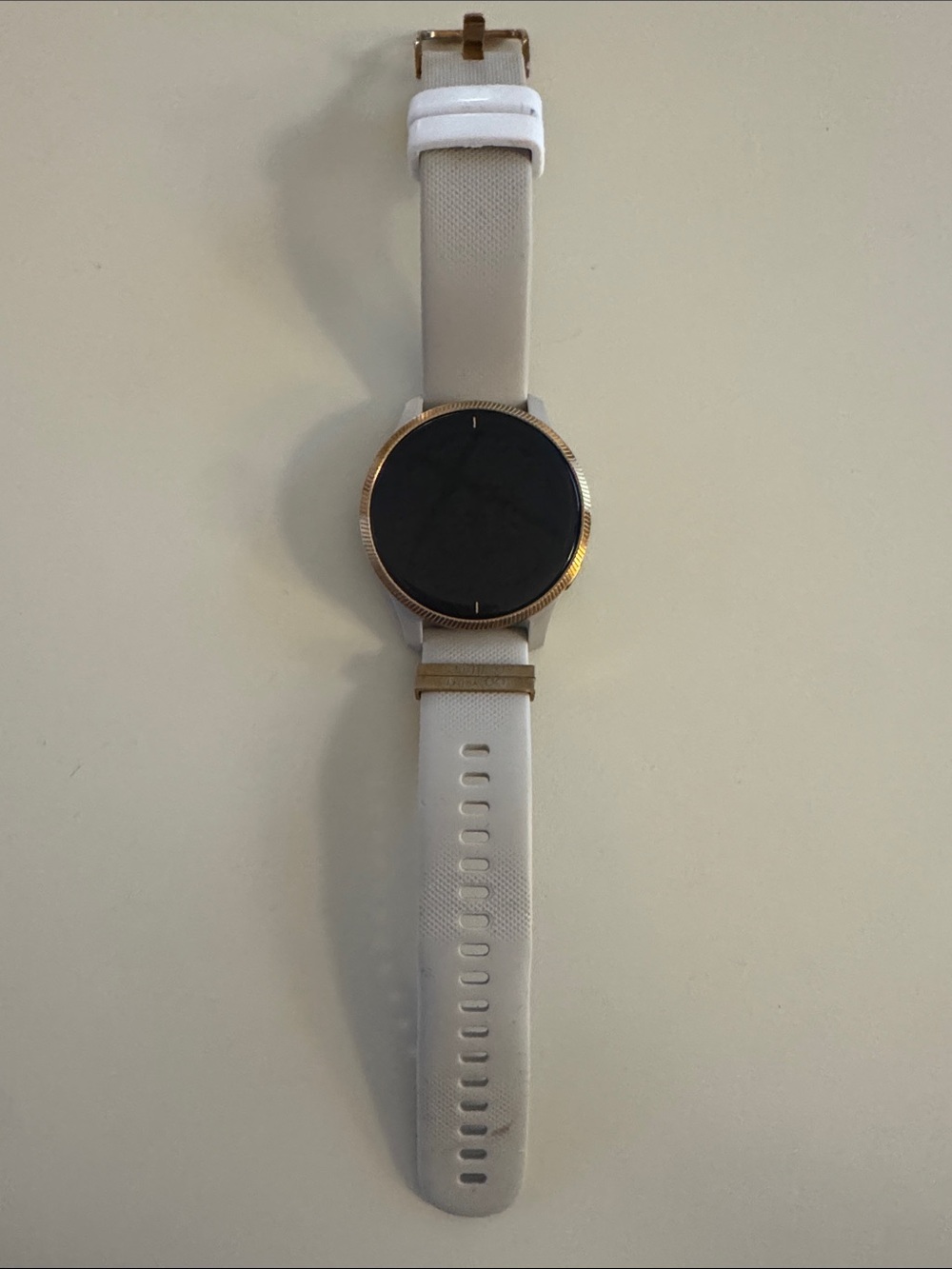 Garmin Venu Smartwatch with tan/cream Strap and rose gold Bezel